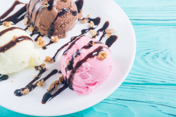 Ice cream with walnuts and chocolate topping