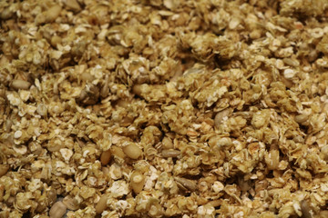 Organic homemade Granola Cereal with oats and almond. Texture oatmeal granola or muesli as background. Top view or flat-lay. Copy space for text.