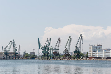 Fototapeta na wymiar Sea industrial ports with cargo cranes and docks, industrial scene, Varna, Bulgaria.
