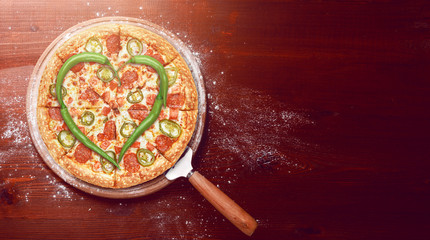 fresh american pizza on wooden table with space for text