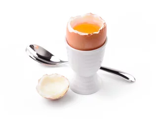 Tuinposter Soft boiled egg on white background. Uovo alla coque © fabiomax