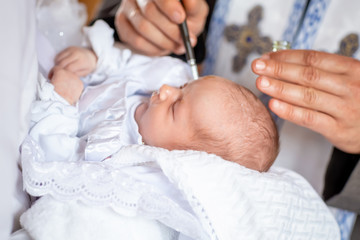Infant baptism ceremony of child christening in church