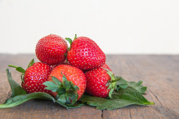 Fresh red strawberry on wood background