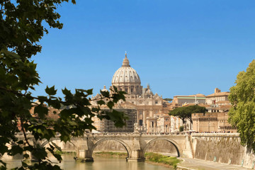 The SaintAngel bridge and St. Peter's Basilica , Rome, Italy .