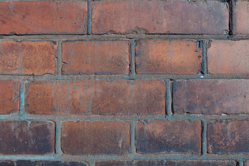 Fototapeta premium old large red brick wall with cement joints