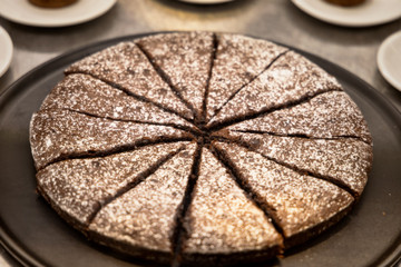 Slices of chocolate cake with sugar
