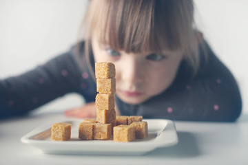Child, sugar cubes. The problem of excessive consumption of sugar by children under the age of 10...