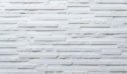 White wall made of gypsum brick. Texture of porous white brick with several bricks. The concept of applying a wall to objects.Wall made of white stone.