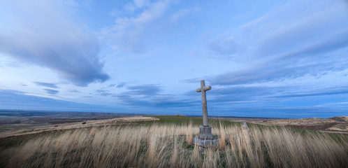 Crossings of stone representative of the Holy Week with background at dusk.