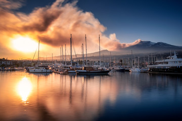Volcanic ash plume at sunset