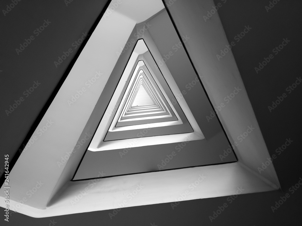 Wall mural black and white triangle geometric infinite spiral pattern minimalist modern staircase architecture 