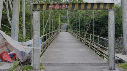 the road, on the suspension bridge