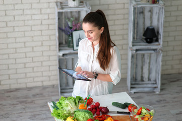 Young Woman Cooking. Healthy Food - Vegetable Salad. Diet. Healthy Lifestyle. Cooking At Home. Prepare Food