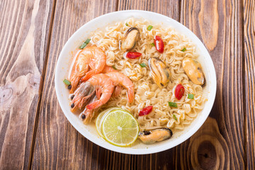 Instant noodles soup with shrimps and mssels . Asian food