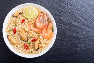 Instant noodles soup with shrimps and mssels . Asian food