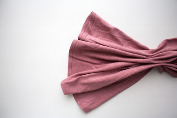 Fototapeta na wymiar Pink folded cotton textile isolated on white background