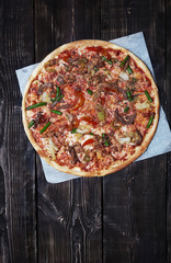 Homemade pizza on a wooden table