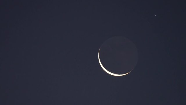 Tokyo,Japan-January 4, 2019: Hard X-ray modulation telescope, HXMT Huiyan, passes near the earthshine moon in Tokyo, Japan, at 6:11AM on Jan 4, 2019
