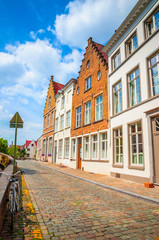 Obraz premium Beautiful narrow streets and traditional houses in the old town of Bruges (Brugge), Belgium