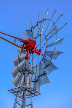 Close up of windmill spokes from behind looking up