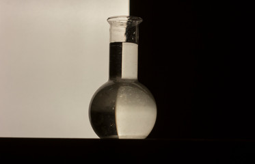 Glass jar with water. Black and white colors