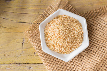 amaranth beans in bowl, on rustic wooden background