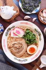 Traditional Japanese ramen withmiso based soup, sliced pork, sliced egg and green onion 