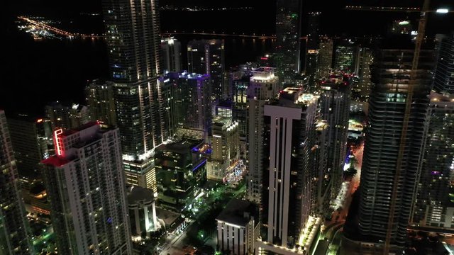 Aerial of architecture, landmarks and sights in Miami, Florida at night.