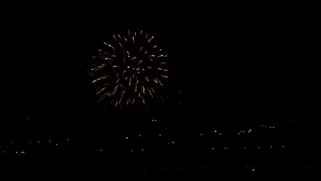 Fireworks flashing in the night holiday sky