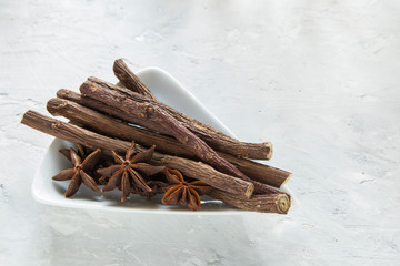 licorice and anise roots in bowl on the table