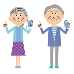 ポップなシニアの夫婦　携帯電話をもって指差し