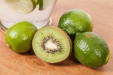 homemade refreshing natural water flavored with lemon, kiwi and mint leaves