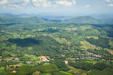 Top view village agriculture area / view green field agricultural farm and  with road to the moutain