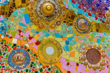 Close up handwork on fancy colorful ceramic decorated the wall of buddhism pagoda