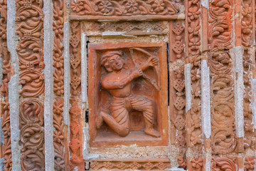 Terracotta art on the wall of Hindu temple , India