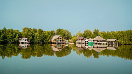 Fototapeta na wymiar Beautiful landscapes with huts and reflection on lake in the morning day.
