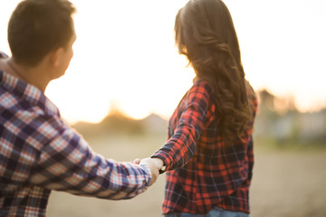 Loving couple walking on the beach