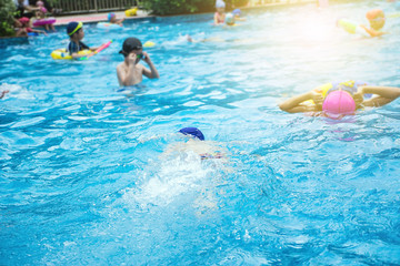 Summer swimming pool Happy children / swim ring