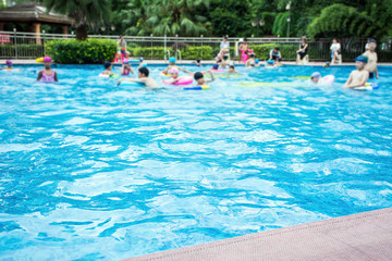 Fototapeta na wymiar Summer swimming pool Happy children / swim ring