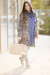 Happy young woman with shopping bags