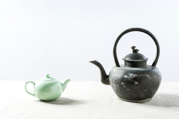 Now teapot and antique teapot