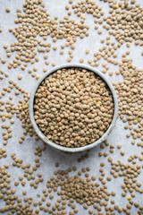 Lentils on concrete background.