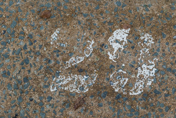 A very faded and worn number 29 road marker on a concrete surface image with copy space in landscape format