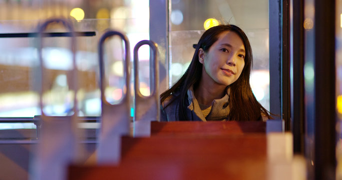 Woman Take The Tram In Hong Kong At Night