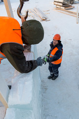 Workers on the installation of the ice town