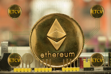 Ethereum coin placed on motherboard, Four ETCV messages in the golden circle, Hard fork concept and give away ETCV coin for holders of ETH coins.