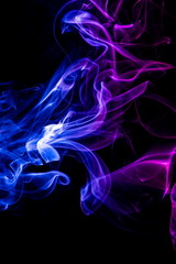 Colored smoke on black background
