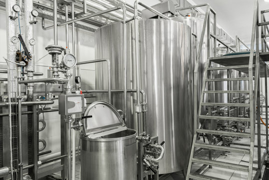 storage and pasteurization tank at the milk factory. equipment at the dairy plant
