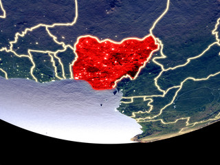 Satellite view of Nigeria from space at night. Beautifully detailed plastic planet surface with visible city lights.