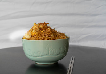 Instant noodle In a bowl of green